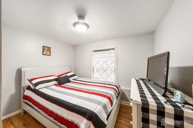 bedroom featuring dark hardwood / wood-style floors