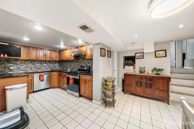 kitchen with appliances with stainless steel finishes and light tile patterned floors