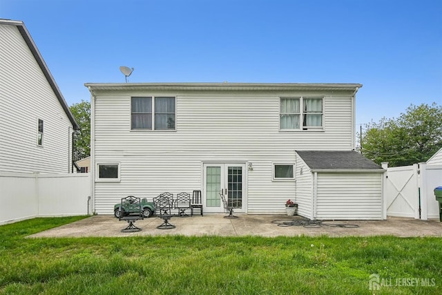 back of property with a patio area, a gate, and french doors