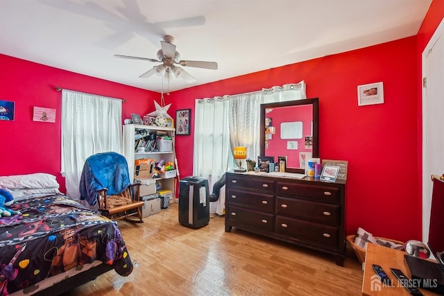 bedroom featuring wood finished floors and a ceiling fan