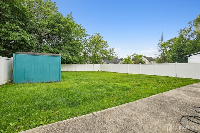 view of yard featuring a shed and an outbuilding