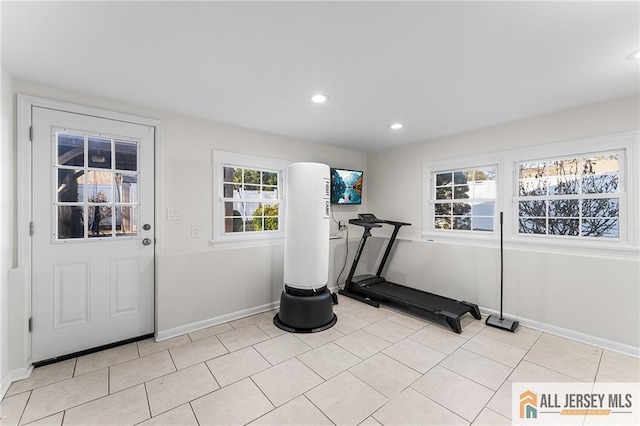 exercise room with light tile patterned flooring, recessed lighting, and baseboards