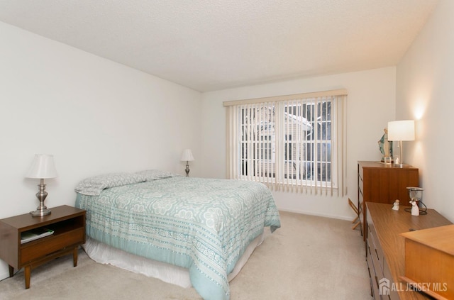 carpeted bedroom with a textured ceiling