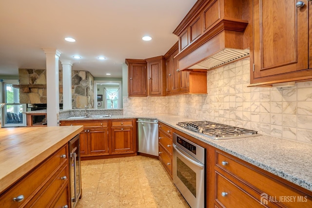 7 Finch Ct, West Windsor, NJ 08550 - kitchen with appliances with stainless steel finishes, wooden counters, tasteful backsplash, brown cabinets, and recessed lighting