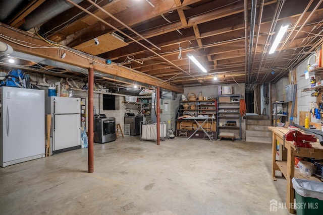 7 Finch Ct, West Windsor, NJ 08550 - unfinished basement with freestanding refrigerator, washer / clothes dryer, and a workshop area