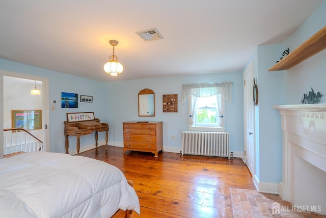 7 Finch Ct, West Windsor, NJ 08550 - bedroom featuring radiator heating unit and hardwood / wood-style flooring