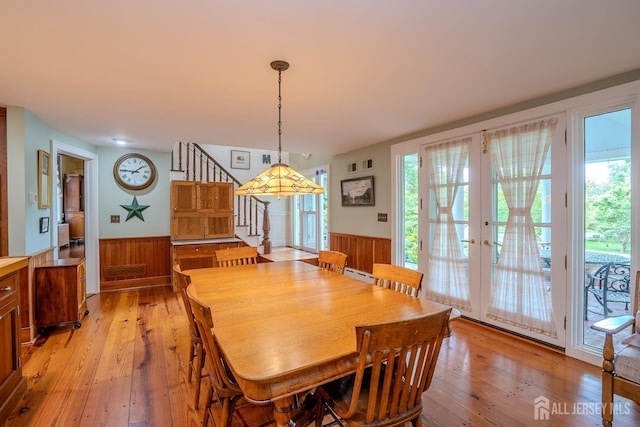 7 Finch Ct, West Windsor, NJ 08550 - dining area featuring a wainscoted wall, light wood finished floors, stairs, plenty of natural light, and wood walls