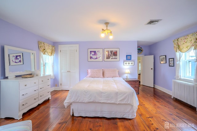 7 Finch Ct, West Windsor, NJ 08550 - bedroom featuring radiator, hardwood / wood-style flooring, and a closet