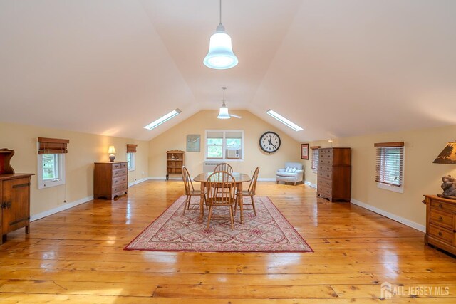 7 Finch Ct, West Windsor, NJ 08550 - dining space featuring a skylight, light wood finished floors, and lofted ceiling