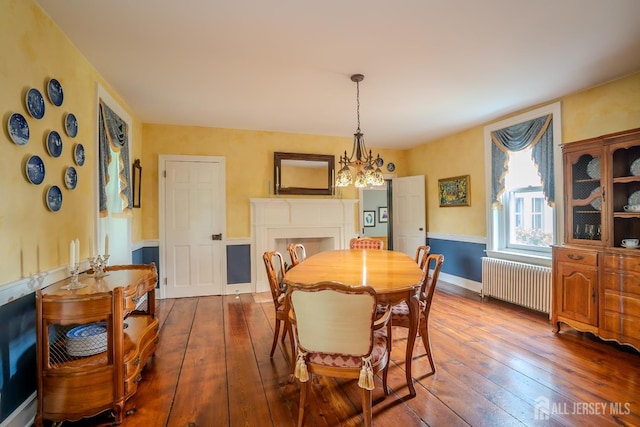 7 Finch Ct, West Windsor, NJ 08550 - dining room featuring radiator, hardwood / wood-style floors, and a chandelier