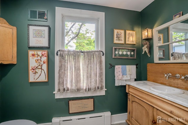 7 Finch Ct, West Windsor, NJ 08550 - bathroom featuring baseboard heating, vanity, and healthy amount of natural light