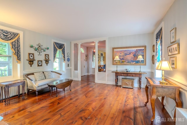 7 Finch Ct, West Windsor, NJ 08550 - living area featuring ornate columns, hardwood / wood-style flooring, and radiator