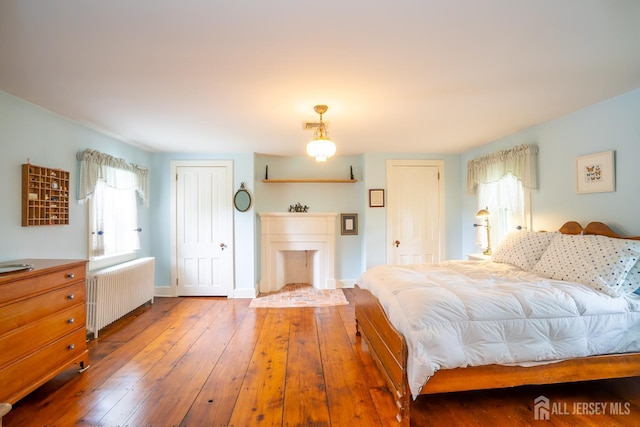 7 Finch Ct, West Windsor, NJ 08550 - bedroom with radiator and hardwood / wood-style flooring