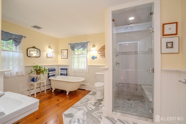 7 Finch Ct, West Windsor, NJ 08550 - full bathroom with a wainscoted wall, baseboard heating, a stall shower, a freestanding tub, and wood finished floors