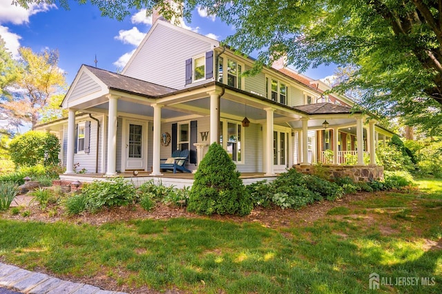 7 Finch Ct, West Windsor, NJ 08550 - view of front of house with a porch, a chimney, and a front yard