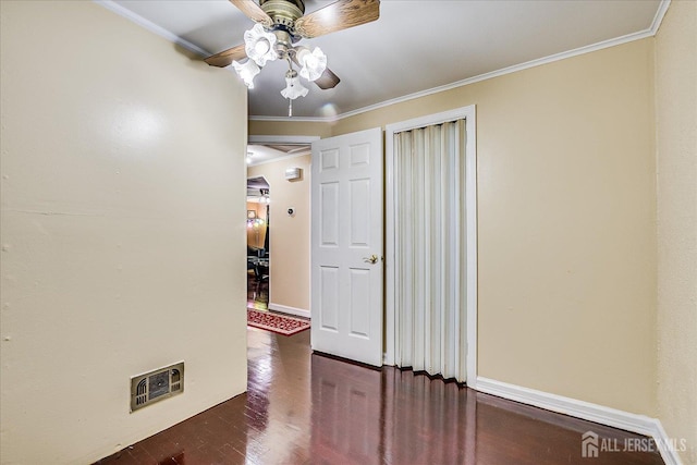 115 W Woodbridge Ave W, Iselin, NJ 08830 - spare room with a ceiling fan, dark wood-style floors, and crown molding