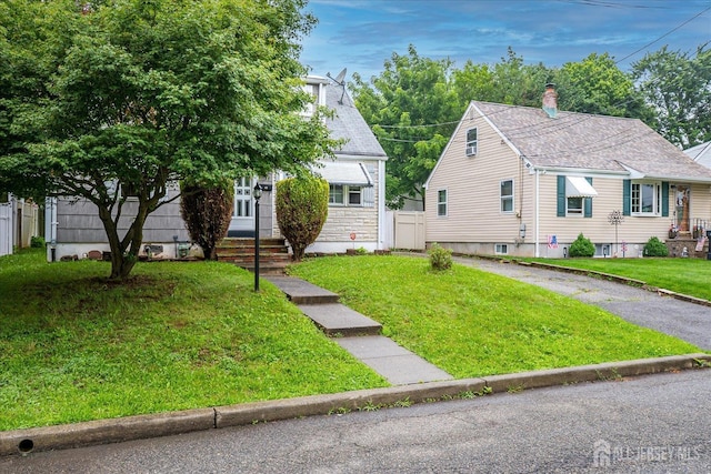 115 W Woodbridge Ave W, Iselin, NJ 08830 - view of front facade featuring a front lawn