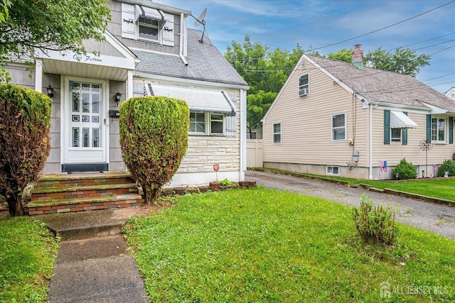 115 W Woodbridge Ave W, Iselin, NJ 08830 - view of front facade with a front lawn, entry steps, and stone siding