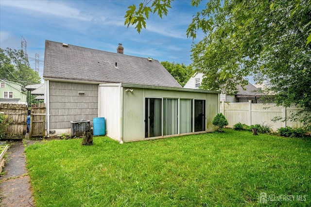 115 W Woodbridge Ave W, Iselin, NJ 08830 - back of house with a chimney and roof with shingles