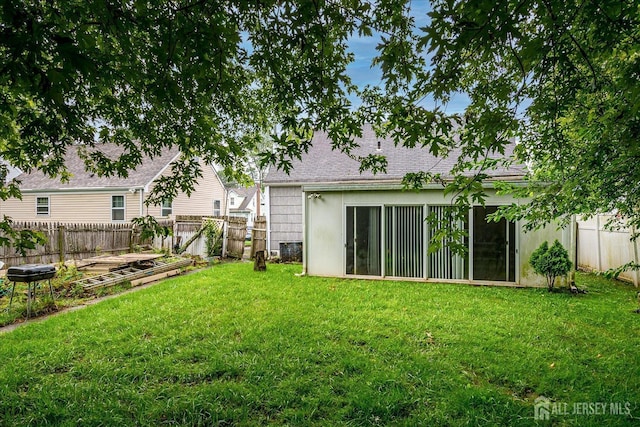 115 W Woodbridge Ave W, Iselin, NJ 08830 - back of house with a garden and a fenced backyard
