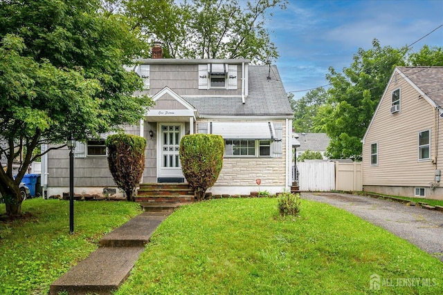 115 W Woodbridge Ave W, Iselin, NJ 08830 - view of front of house with a chimney and driveway