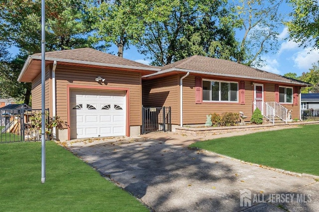 ranch-style house featuring a front lawn and a garage