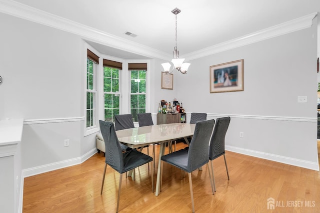 22 Daffodil Way, Old Bridge, NJ 08857 - dining room featuring a chandelier, light wood-style flooring, and crown molding