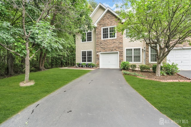 22 Daffodil Way, Old Bridge, NJ 08857 - view of front of house with stone siding, asphalt driveway, a front lawn, and a garage