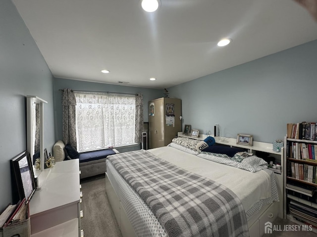 bedroom with recessed lighting and carpet