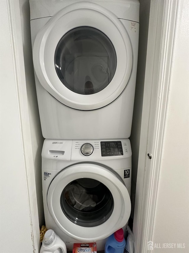 laundry room featuring stacked washer and dryer