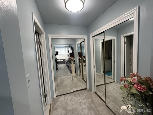 corridor with carpet flooring