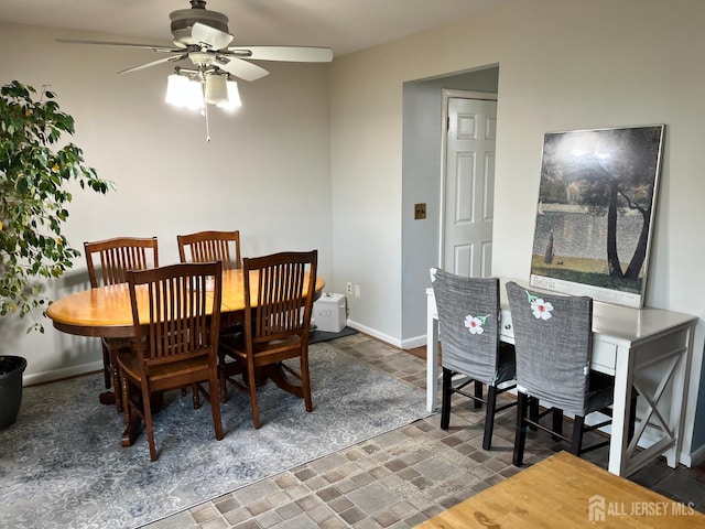 857 Jamestown Rd, East Windsor, NJ 08520 - dining room featuring ceiling fan and stone finish flooring