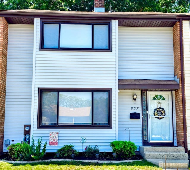 857 Jamestown Rd, East Windsor, NJ 08520 - view of front facade with a chimney