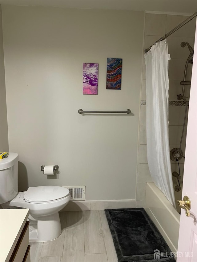 518 Petunia Ln N, Whiting, NJ 08759 - full bath with vanity, toilet, shower / bath combo with shower curtain, and baseboards