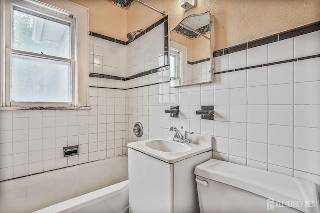 58 Fern St, Edison, NJ 08817 - full bath featuring tile walls, plenty of natural light, vanity, and tasteful backsplash