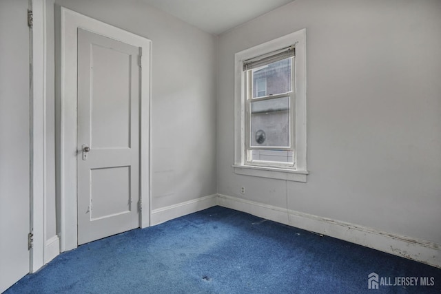 58 Fern St, Edison, NJ 08817 - empty room featuring dark carpet and baseboards