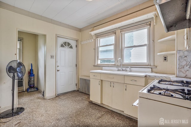 58 Fern St, Edison, NJ 08817 - kitchen featuring extractor fan, light countertops, radiator heating unit, white range with gas cooktop, and open shelves