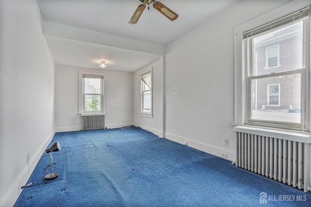 58 Fern St, Edison, NJ 08817 - empty room featuring radiator, carpet, and a ceiling fan