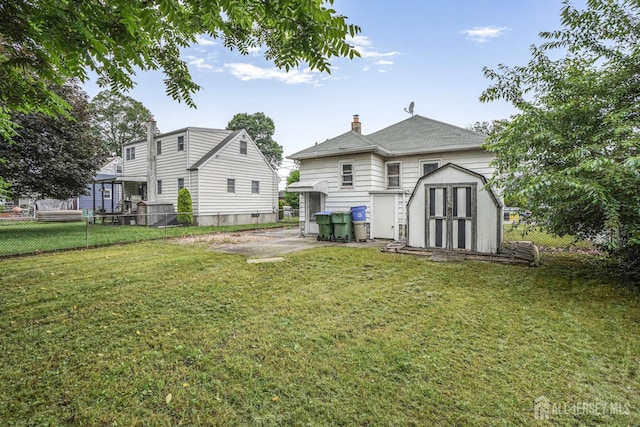 58 Fern St, Edison, NJ 08817 - rear view of property with a storage shed, a fenced backyard, and a chimney