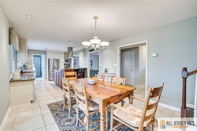 dining room with recessed lighting, baseboards, an inviting chandelier, and light tile patterned floors