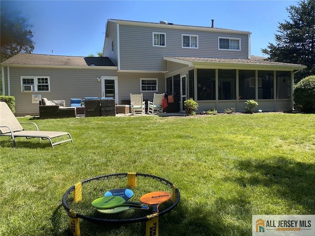 back of property featuring an outdoor living space, a lawn, a shingled roof, and a sunroom