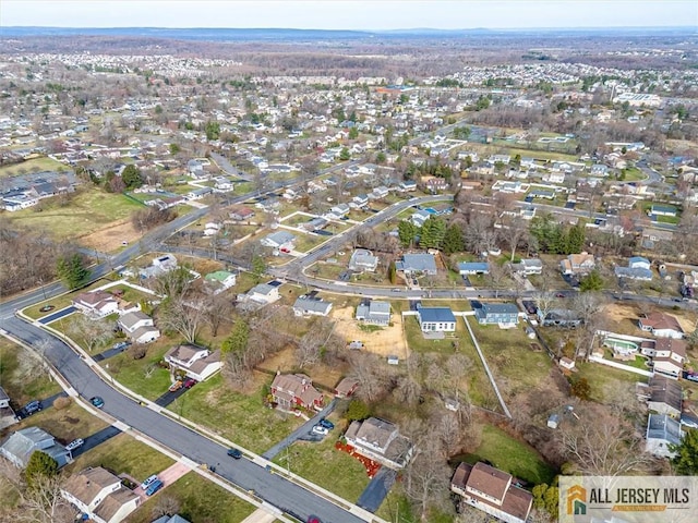 birds eye view of property with a residential view