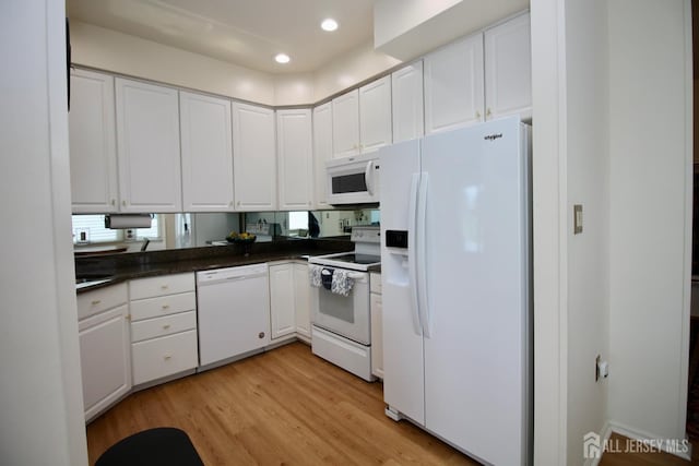124 Chichester Rd, Monroe, NJ 08831 - kitchen with white appliances, dark countertops, white cabinets, light wood-type flooring, and recessed lighting