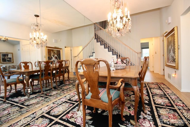 124 Chichester Rd, Monroe, NJ 08831 - dining space featuring a chandelier, stairs, light wood-style floors, and baseboards