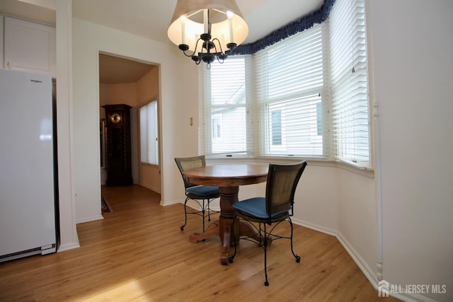 124 Chichester Rd, Monroe, NJ 08831 - dining area featuring light wood-style flooring, a chandelier, and baseboards