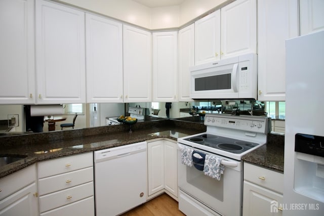 124 Chichester Rd, Monroe, NJ 08831 - kitchen with white appliances, white cabinets, dark stone counters, and light wood-style flooring