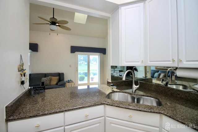 124 Chichester Rd, Monroe, NJ 08831 - kitchen featuring a sink, white cabinets, a ceiling fan, and dark stone countertops