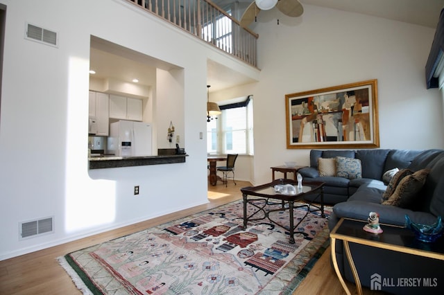 124 Chichester Rd, Monroe, NJ 08831 - living room featuring ceiling fan, wood finished floors, baseboards, and a high ceiling