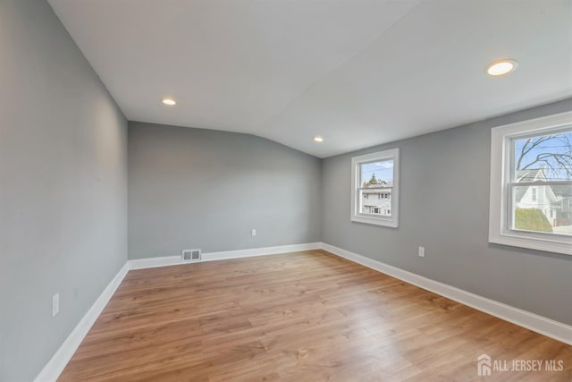 48 Columbus Ave, Edison, NJ 07008 - empty room featuring vaulted ceiling, light wood finished floors, baseboards, and recessed lighting