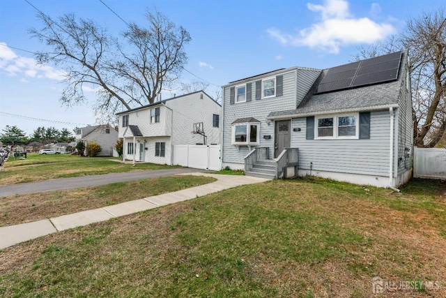 48 Columbus Ave, Edison, NJ 07008 - traditional-style home with roof mounted solar panels and roof with shingles